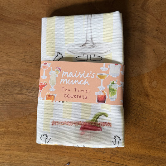 Cocktails tea towel with yellow stripes folded in its Maisie's Munch paper band