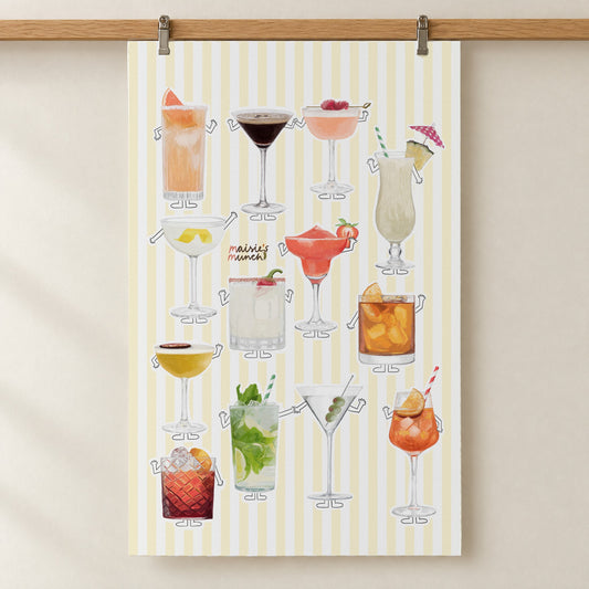Cocktails tea towel with yellow stripes hanging from a wooden rail